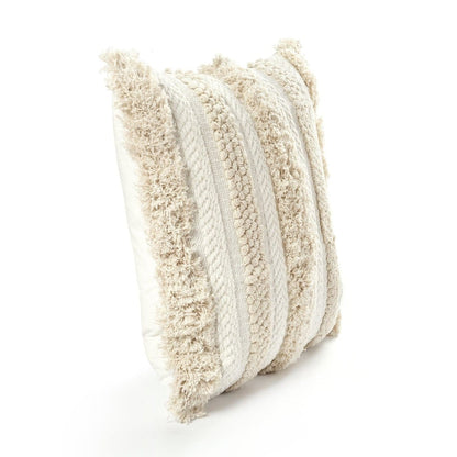 Ivory tufted cotton pillow cover styled in a warm boho interior