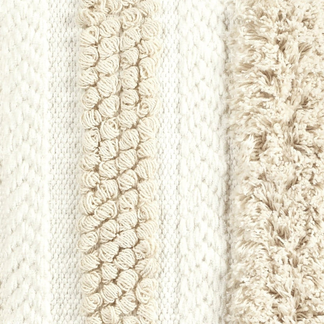 Textured ivory cotton pillow cover styled as a decorative accent