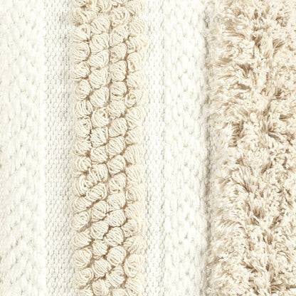 Textured ivory cotton pillow cover styled as a decorative accent